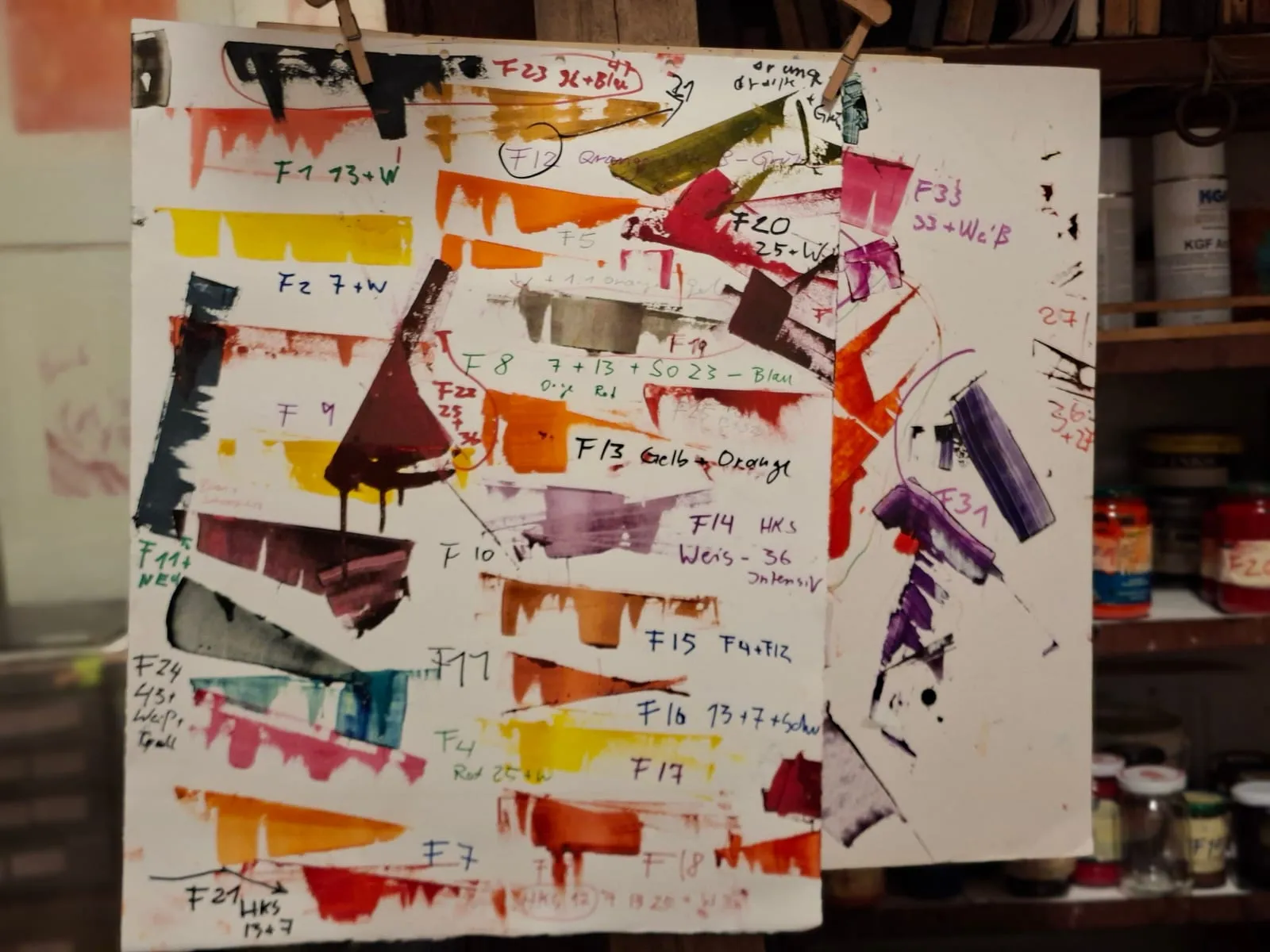Proof sheet with dozens of colour swatches and handwritten recipes