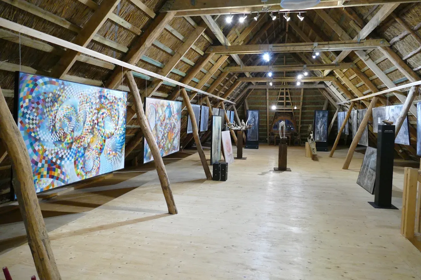 Paintings beneath the historic timber roof in the loft of the barn